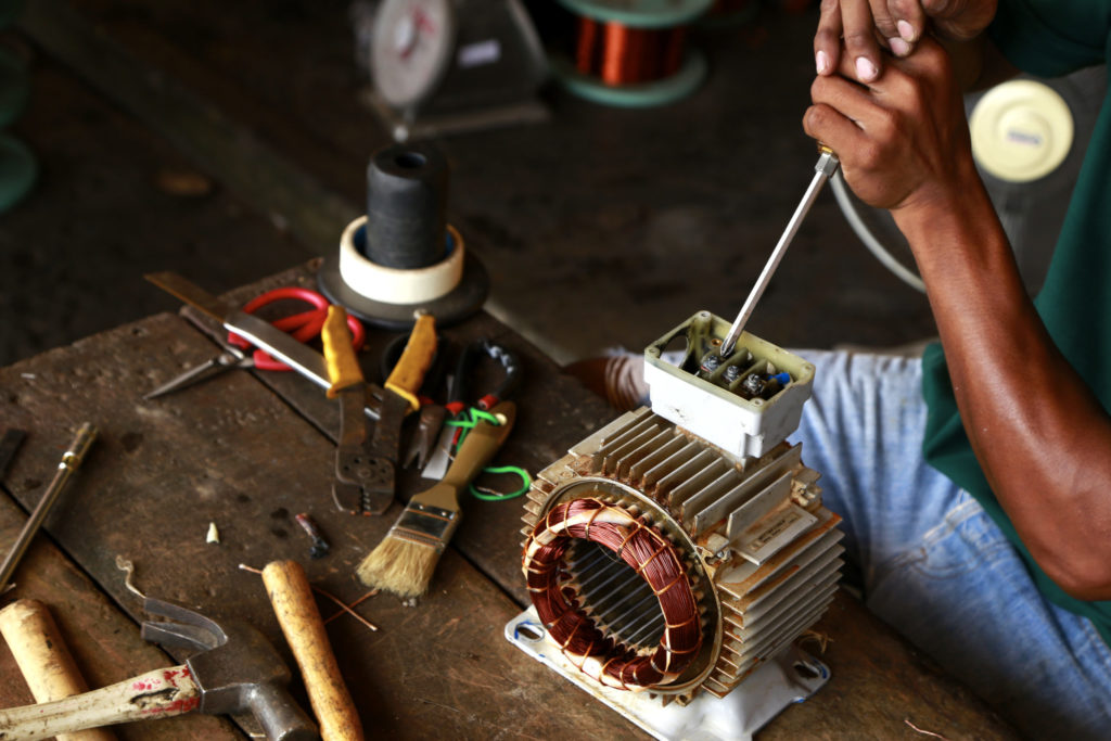 repairman during maintenance work of electric motors